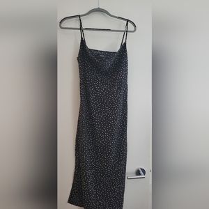 Black polkadot slip dress with slit